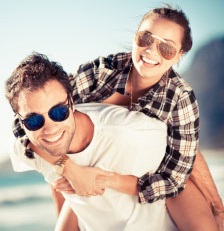 image of man and woman wearing sunglasses.